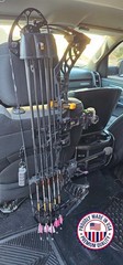 Headrest bow hanger with rubber insert