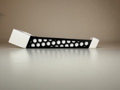Headrest bow hanger with rubber insert