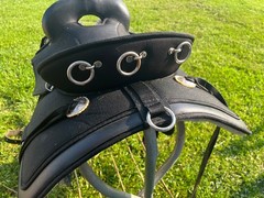 17 ABETTA Light Weight Western Trail Saddle with pad, girth, and stirrups.