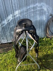 17 ABETTA Light Weight Western Trail Saddle with pad, girth, and stirrups.