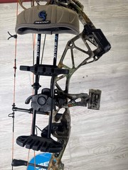 Used Bear Paradox 55-70# RH Real Tree Package
