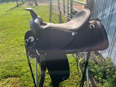 17 ABETTA Light Weight Western Trail Saddle with pad, girth, and stirrups.