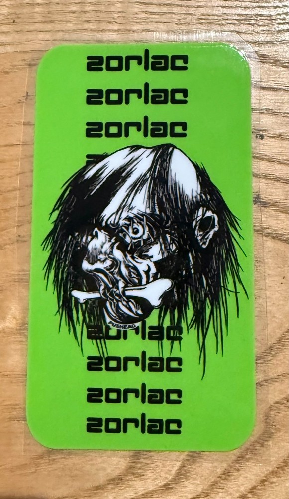 Zorlac Double Cut / Shrunken head sticker 4″ x 2.25″ Green