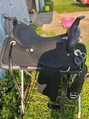 17 ABETTA Light Weight Western Trail Saddle with pad, girth, and stirrups.