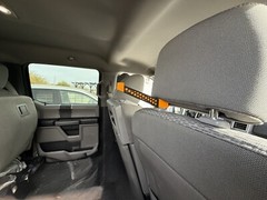 Headrest bow hanger with rubber insert