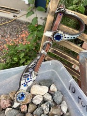 Western horse headstall featuring blue rhinestones and cowhide inlays