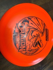 Innova Dragon fairway driver, a popular disc for beginner disc golfers orange
