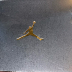 brand new item in your image is a pair of Air Jordan 10 TD Mid Football Cleats