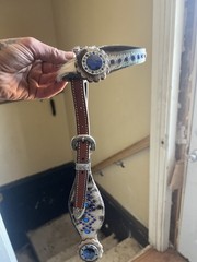 Western horse headstall featuring blue rhinestones and cowhide inlays