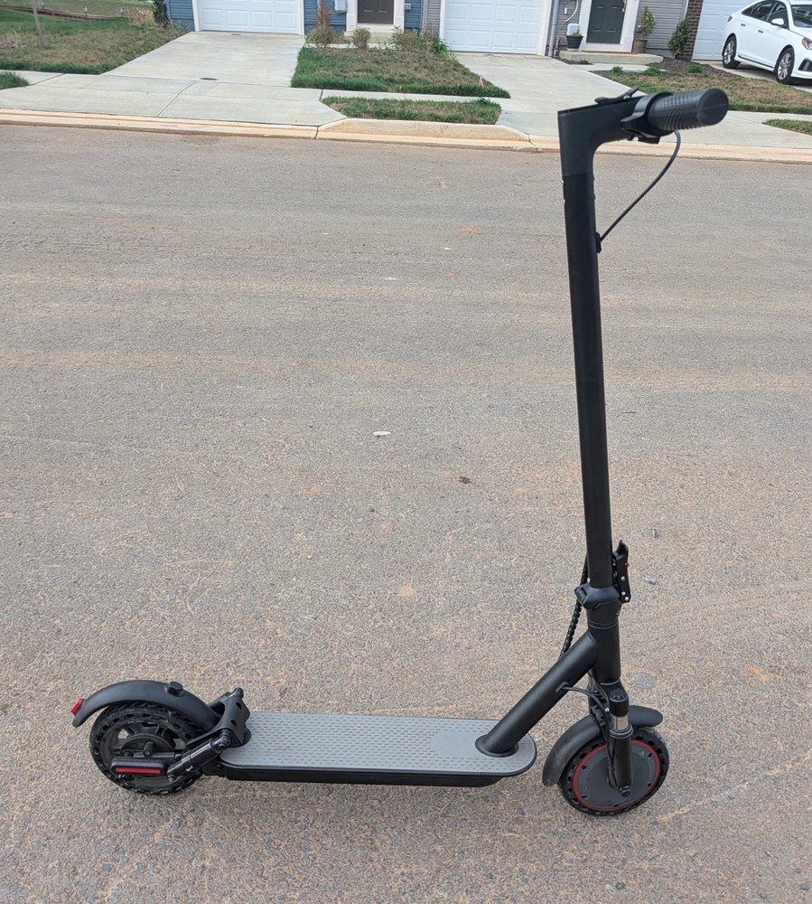 Foldable e-scooter for adults under 275 pounds, less than 1 month old.