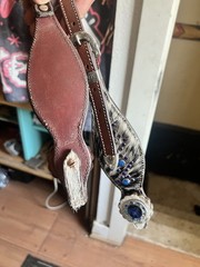 Western horse headstall featuring blue rhinestones and cowhide inlays