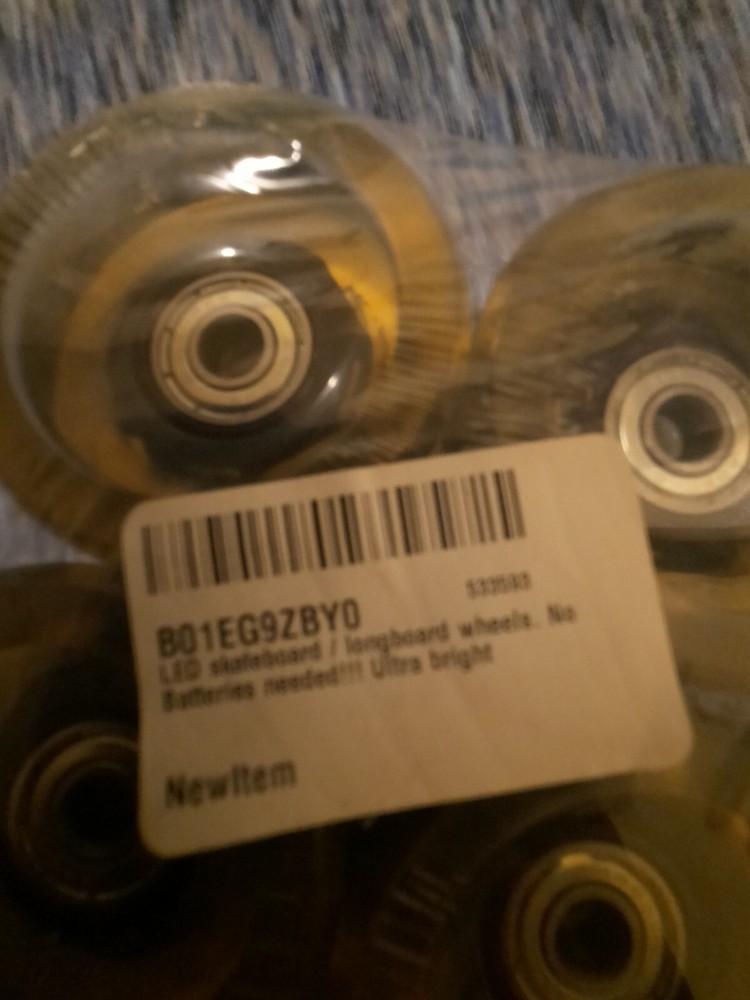 Skateboard Wheels (X4) ***NO BATTERIES REQUIRED*** puka brand. light up wheels.