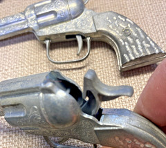 VINTAGE 1950s PAIR OF SINGLE SHOT CAP GUNS WITH CARDBOARD HOLSTERS UNMARKED