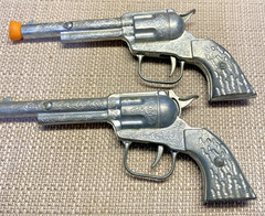 VINTAGE 1950s PAIR OF SINGLE SHOT CAP GUNS WITH CARDBOARD HOLSTERS UNMARKED