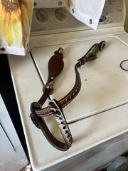 Western horse headstall featuring blue rhinestones and cowhide inlays
