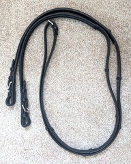 Bobby’s black leather flat English reins with hand stops and center buckle 54 in
