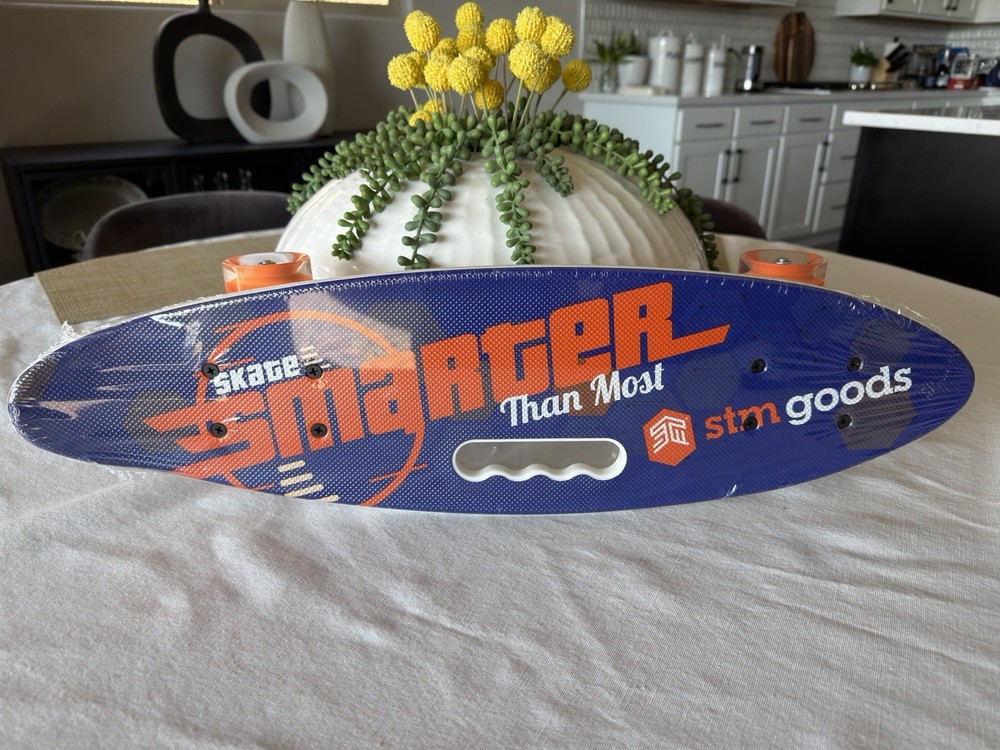 Brand new STM Mini Skate Board – 23 in length x 6.2 in width. Wheels Lights Up!