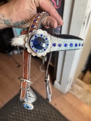 Western horse headstall featuring blue rhinestones and cowhide inlays