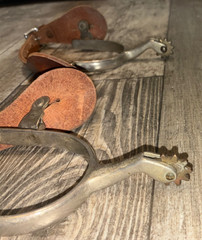 2 1/2 WESTERN SPURS WITH LEATHER STRAPS , SPINNING ROWELS