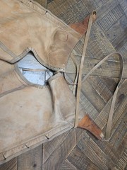 vintage western chaps feature a hand-tooled floral motif on the yoke