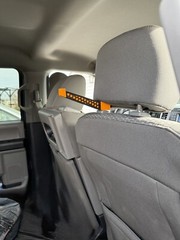 Headrest bow hanger with rubber insert