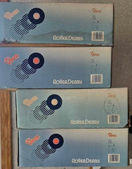 pacer roller skates, new in box. Top of box says Roller Derby, universal size