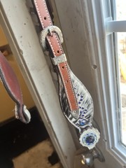 Western horse headstall featuring blue rhinestones and cowhide inlays