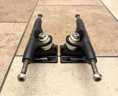 Thunder 147 Hi Hollow Lights 24K Sonora Skateboarding Trucks Black/Gold