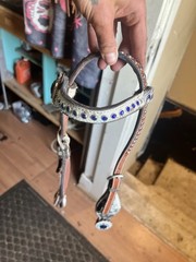 Western horse headstall featuring blue rhinestones and cowhide inlays