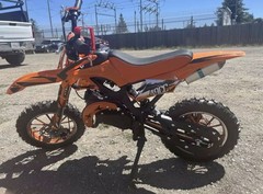 PEGASUS™ 49cc 2-Stroke Mini Motorcycle Orange Off-Road Tires, F/R Shock, Durable
